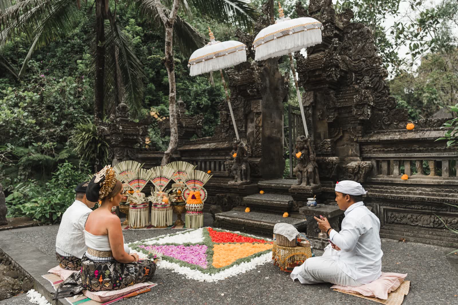 Traditional Balinese Hindu blessing ceremony at a temple